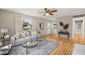 Inviting living room with hardwood floors, light gray walls, and modern furnishings at 5815 Windham Dr, Raleigh, NC 27609