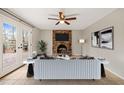 Cozy living room with brick fireplace, french doors, and neutral décor at 5815 Windham Dr, Raleigh, NC 27609