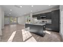 Modern kitchen with a granite island, stainless steel appliances, and an open layout to the dining area at 801 Pryor St # 48, Mebane, NC 27302