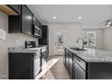 Sleek kitchen with granite countertops, stainless steel appliances, and ample cabinet storage at 801 Pryor St # 48, Mebane, NC 27302