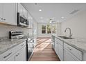 Modern kitchen featuring granite counters, stainless appliances and hardwood style floors at 803 Pryor St # 47, Mebane, NC 27302