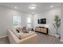 Comfortable living room featuring stylish furniture, a cozy sofa and modern entertainment setup at 814 Silo Park Dr, Wake Forest, NC 27587