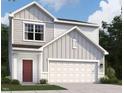 New construction home with gray siding, a front-facing two car garage, and classic architectural design at 1161 Centerview, Nashville, NC 27856
