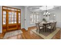 Traditional dining room showcasing beautiful hardwood floors, natural lighting and space for a table for six at 1196 Smith Creek Way, Wake Forest, NC 27587