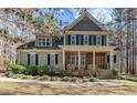 Inviting two-story home with stone accents and a covered porch at 1196 Smith Creek Way, Wake Forest, NC 27587