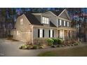 Lovely two-story home with attached garage, manicured landscaping and inviting curb appeal at 1196 Smith Creek Way, Wake Forest, NC 27587