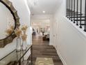 Elegant entryway boasting wood floors, light walls, and an open view to the living spaces at 1205 Coral Cay Bnd, Wake Forest, NC 27587