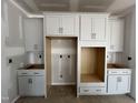 Spacious kitchen featuring unfinished cabinets and stainless steel appliances, ready for personalized touches at 1509 Erastus Ct # 48, Fuquay Varina, NC 27526