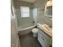 Clean bathroom with tub and shower combination, updated vanity, and stylish flooring at 167 Spaulding Dr, Rocky Mount, NC 27801