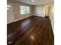 Bright living room featuring refinished hardwood floors, neutral walls and natural light at 167 Spaulding Dr, Rocky Mount, NC 27801