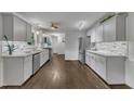 Modern kitchen featuring gray cabinets, stainless appliances, and sleek countertops at 202 Brook Ln, Durham, NC 27712