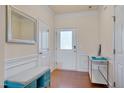 Welcoming entryway with wainscoting, a bench, and a mirrored wall decor at 211 Brier Crossings Loop, Durham, NC 27703