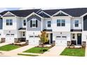 New construction townhomes feature attached garages, covered entries and beautifully landscaped lawns at 26 Twin Birch Dr, Angier, NC 27501
