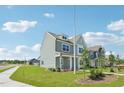 Inviting two-story home featuring a classic design with manicured lawns and sidewalks in a well-planned community at 2880 Quarry Rd # 163, Rolesville, NC 27571
