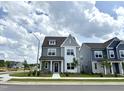 Attractive two-story home with tidy landscaping and a sidewalk leading to the front door at 2880 Quarry Rd # 163, Rolesville, NC 27571