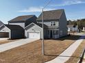 This home features a two-car garage and spacious driveway at 2880 Quarry Rd # 163, Rolesville, NC 27571