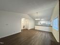 Open-concept living area with wood-look floors and plenty of natural light at 292 Cedar Lake Rd # A, Chapel Hill, NC 27516