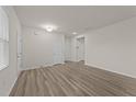 Bright and airy living room with modern flooring and neutral paint at 3413 Dragonfly River Ct, Raleigh, NC 27604