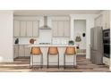 Beautiful kitchen with stainless appliances, an island with seating, subway tile backsplash, and ample cabinet space at 347 Canyon Spring Trl, Wake Forest, NC 27587