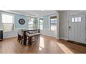Elegant dining area with modern lighting and large windows for natural light at 3916 Bostwyck Dr, Fuquay Varina, NC 27526