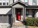 Inviting front entrance features a red door and stylish brick accents at 3916 Bostwyck Dr, Fuquay Varina, NC 27526
