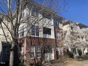 Inviting condo building with brick facade and charming balconies, offering a blend of classic and modern design elements at 421 Glencrest Pl, Chapel Hill, NC 27514