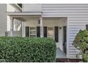 Inviting covered front porch with address number and black front door at 4622 Vendue Range Dr, Raleigh, NC 27604
