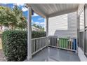 Open-air front porch with white railing, offering a glimpse of the surrounding neighborhood at 4622 Vendue Range Dr, Raleigh, NC 27604
