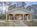 Charming covered porch featuring wooden supports and country-style decorations at 577 Dixon Rd # D, Willow Springs, NC 27592