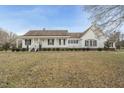 Inviting home featuring a welcoming front porch and meticulously maintained landscaping at 582 Ebenezer Church Rd, Coats, NC 27521