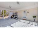 Relaxing covered front porch with rocking chairs and a potted plant at 902 Zion Church Rd, Sanford, NC 27330