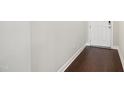 A clean hallway with hardwood floors and neutral wall paint at 1015 Rexburg Dr, Cary, NC 27513