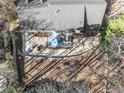 Aerial view of the backyard with a patio, seating area, and lush greenery at 104 Glenmore Rd, Cary, NC 27519