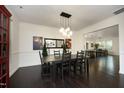 Dining room with hardwood floors, modern light fixture, and stylish decor at 156 Stoney Creek Way, Chapel Hill, NC 27517