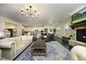 Spacious living room with a stone fireplace, open layout, and seamless flow to the kitchen at 156 Stoney Creek Way, Chapel Hill, NC 27517