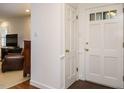 Bright foyer with white trim, traditional doors, and views to the living room at 2001 Manuel St, Raleigh, NC 27612
