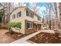 Attractive two-story home with brick accents, green shutters, and well-maintained landscaping at 203 Lexington Rd, Chapel Hill, NC 27516