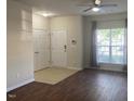 Bright entryway with a large window, wood-look floors, and multiple closets for convenient storage at 21 Suncrest Ct, Durham, NC 27703