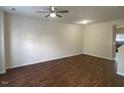 Spacious living room with hardwood floors, ceiling fan, and a neutral color palette awaiting personalization at 21 Suncrest Ct, Durham, NC 27703