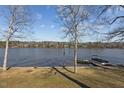 Scenic lake view with a private dock, perfect for boating and enjoying the waterfront at 220 Choctaw Dr, Louisburg, NC 27549