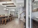Grand entryway featuring hardwood floors, stairs, and views into the dining and living areas at 2253 Greenbrook Ln, Durham, NC 27705