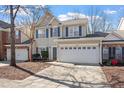 Charming two-story home with a two-car garage and blue shutters at 3439 Archdale Dr, Raleigh, NC 27614