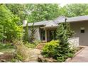 Charming home featuring landscaped yard, wooden steps, and entryway at 3604 Pasture Rd, Hillsborough, NC 27278