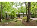 Charming home featuring landscaped yard, wooden steps, and entryway at 3604 Pasture Rd, Hillsborough, NC 27278