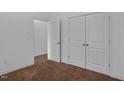 Neutral bedroom with carpeting and closet with double doors at 3924 Volkswalk Pl, Raleigh, NC 27610