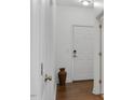 Bright entryway with hardwood floors and neutral color palette at 3924 Volkswalk Pl, Raleigh, NC 27610
