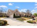 Beautiful home showcasing a well-maintained lawn, spacious driveway, and attached garage at 4014 Peeler Ct, Rolesville, NC 27571