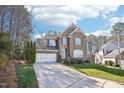 Traditional brick home with an attached two-car garage and a well-maintained lawn and shrubbery at 508 Spencer Crest Ct, Cary, NC 27513