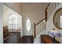 Bright foyer with staircase and stylish decor at 7127 Lark Ln, Sanford, NC 27332