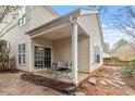 Relaxing covered back patio with comfortable seating and serene backyard views, perfect for outdoor living at 8412 Lunar Stone Pl, Raleigh, NC 27613
